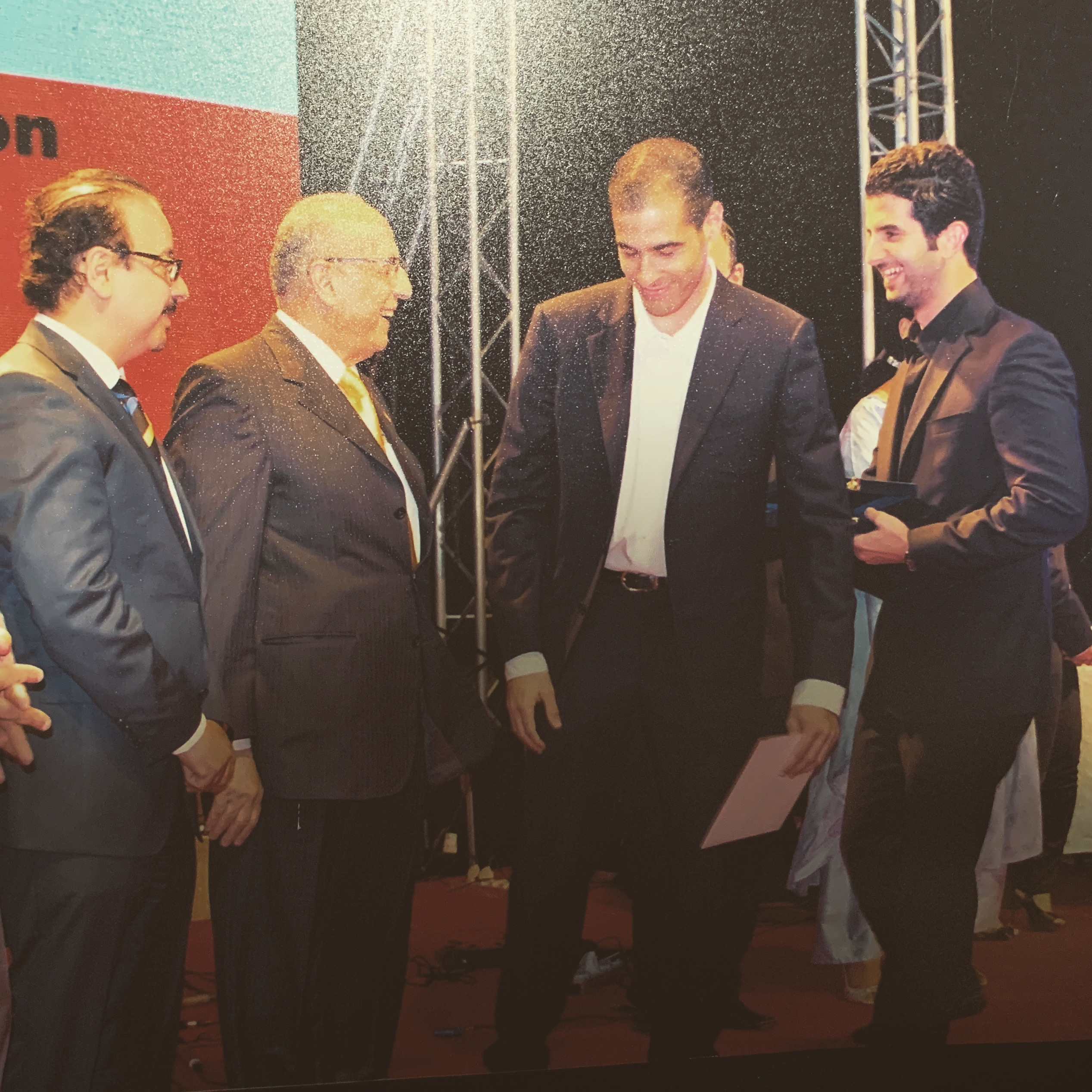 Saeed Al Hasan at award ceremony with officials